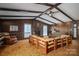 Spacious living room with a brick fireplace and wooden beams at 1408 Gaither Rd, Belmont, NC 28012