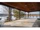 Covered porch overlooking the lake, perfect for relaxing at 1408 Gaither Rd, Belmont, NC 28012