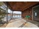 Spacious covered porch with lake views and green chairs at 1408 Gaither Rd, Belmont, NC 28012