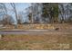 Partially ruined stone wall along a grassy area at 1408 Gaither Rd, Belmont, NC 28012