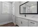 Bathroom showcasing white cabinets with a marble countertop, and a large mirror at 1846 Yardley St, Rock Hill, SC 29732