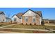 One story home with stone and siding accents, red door, and landscaped yard at 1846 Yardley St, Rock Hill, SC 29732