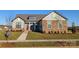 One-story home with stone and siding accents, red door, and landscaped yard at 1846 Yardley St, Rock Hill, SC 29732