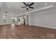 Spacious living area with hardwood floors, elegant lighting, and open layout to the kitchen at 1846 Yardley St, Rock Hill, SC 29732