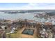 Stunning aerial view of waterfront property and tennis courts at 18669 Vineyard Point Ln, Cornelius, NC 28031