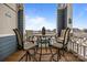 Enjoy water views from this balcony with small table and chairs at 18669 Vineyard Point Ln, Cornelius, NC 28031