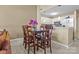 Kitchen features a dining area with wood table and chairs at 18669 Vineyard Point Ln, Cornelius, NC 28031