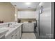 Well-equipped kitchen featuring white cabinets and stainless steel appliances at 18669 Vineyard Point Ln, Cornelius, NC 28031