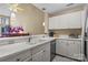 Modern kitchen with white cabinets and stainless steel appliances at 18669 Vineyard Point Ln, Cornelius, NC 28031