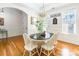 Formal dining room with hardwood floors, white wainscoting, and a charming table setting at 2008 Fallondale Rd, Waxhaw, NC 28173