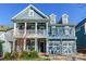 Two-story home with a front porch, white columns, and a two-car garage at 2008 Fallondale Rd, Waxhaw, NC 28173