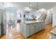 Spacious kitchen boasts an island, hardwood floors, and modern appliances at 2008 Fallondale Rd, Waxhaw, NC 28173