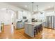 Modern kitchen with granite countertops, stainless steel appliances, and an island at 2008 Fallondale Rd, Waxhaw, NC 28173