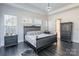 Spacious main bedroom with dark wood flooring and large windows at 2008 Fallondale Rd, Waxhaw, NC 28173