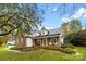 Charming ranch home with white accents and landscaping at 214 Heather Glen Ln, Belmont, NC 28012