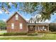 Brick ranch home with front porch and landscaping at 214 Heather Glen Ln, Belmont, NC 28012