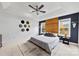 Main bedroom with wood accent wall and ceiling fan at 214 Heather Glen Ln, Belmont, NC 28012