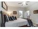 Bright bedroom with a comfortable bed, stylish bedding, and access to a private bathroom at 217 Ridge Reserve Dr, Lake Wylie, SC 29710