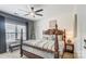 Spacious bedroom with a large bed, ceiling fan, and plenty of natural light at 217 Ridge Reserve Dr, Lake Wylie, SC 29710