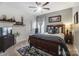 Spacious bedroom with a wooden bed frame, a ceiling fan, and plenty of natural light at 217 Ridge Reserve Dr, Lake Wylie, SC 29710