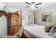 Well-lit bedroom featuring a wooden armoire and a comfortable bed at 217 Ridge Reserve Dr, Lake Wylie, SC 29710