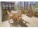 Relaxing deck with a table and chairs, providing a peaceful outdoor space at 217 Ridge Reserve Dr, Lake Wylie, SC 29710