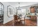 Bright kitchen breakfast area with hardwood floors and glass table at 217 Ridge Reserve Dr, Lake Wylie, SC 29710