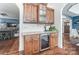 Kitchen wet bar with granite countertop and wine cooler at 217 Ridge Reserve Dr, Lake Wylie, SC 29710