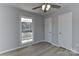 Bright bedroom with new floors, ceiling fan, and two closets at 2205 E Brief Rd, Monroe, NC 28110