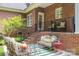 Brick patio with seating area, metal furniture, and striped rug at 2324 Ryan Conley Ct, Gastonia, NC 28056