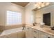 Bathroom with double vanity, soaking tub and large window at 2324 Ryan Conley Ct, Gastonia, NC 28056