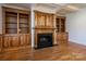 Living room with hardwood floors and a built in wooden fireplace at 2324 Ryan Conley Ct, Gastonia, NC 28056