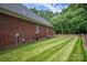 Brick house exterior with green lawn and air conditioning unit at 2324 Ryan Conley Ct, Gastonia, NC 28056