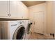 Laundry room with white cabinets, washer, and dryer at 2324 Ryan Conley Ct, Gastonia, NC 28056