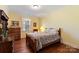 Charming bedroom with wood floors and a dresser at 261 Nabors Rd, Statesville, NC 28677