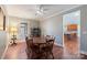 Dining room with hardwood floors, a wooden table, and view into kitchen at 261 Nabors Rd, Statesville, NC 28677