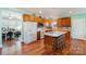 Open kitchen with an island, hardwood floors, and lots of cabinet space at 261 Nabors Rd, Statesville, NC 28677