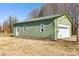 Detached workshop with overhead door and ample storage space at 261 Nabors Rd, Statesville, NC 28677