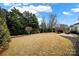 Spacious backyard with grassy lawn and mature trees at 3024 Ambleside Dr, Fort Mill, SC 29707