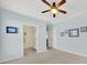 Light blue bedroom with carpet flooring and ceiling fan at 3024 Ambleside Dr, Fort Mill, SC 29707