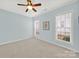 Light blue bedroom with carpet, ceiling fan and window at 3024 Ambleside Dr, Fort Mill, SC 29707