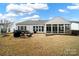 White house with sunroom and patio, offering curb appeal at 3024 Ambleside Dr, Fort Mill, SC 29707