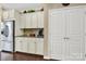 White kitchen cabinets and granite countertops with stainless steel appliances at 3024 Ambleside Dr, Fort Mill, SC 29707