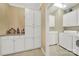 Convenient laundry room with washer, dryer, and ample cabinet storage at 3024 Ambleside Dr, Fort Mill, SC 29707