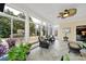 Relaxing sunroom with wicker chairs and access to backyard at 3024 Ambleside Dr, Fort Mill, SC 29707