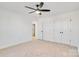 Well-lit bedroom with ceiling fan and double door closet at 3040 Swallowtail Ln # 36, Kannapolis, NC 28083