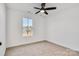 Spacious bedroom with window, ceiling fan, and carpet at 3040 Swallowtail Ln # 36, Kannapolis, NC 28083