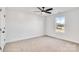 Spacious bedroom with window, ceiling fan, and carpet at 3040 Swallowtail Ln # 36, Kannapolis, NC 28083