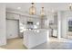 Modern kitchen with gray cabinets, white quartz island, and gold light fixtures at 3040 Swallowtail Ln # 36, Kannapolis, NC 28083