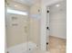 Bright shower with glass enclosure and built-in shelving at 3040 Swallowtail Ln # 36, Kannapolis, NC 28083